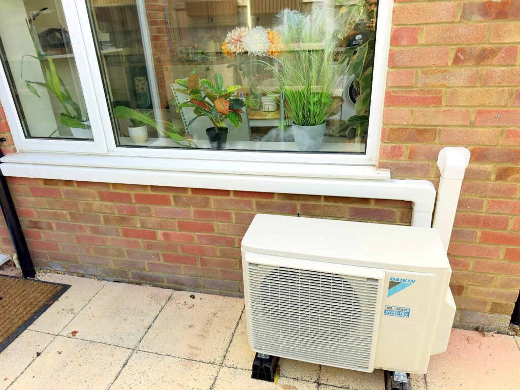 Daikin outdoor condenser on a patio – air conditioning Dorking